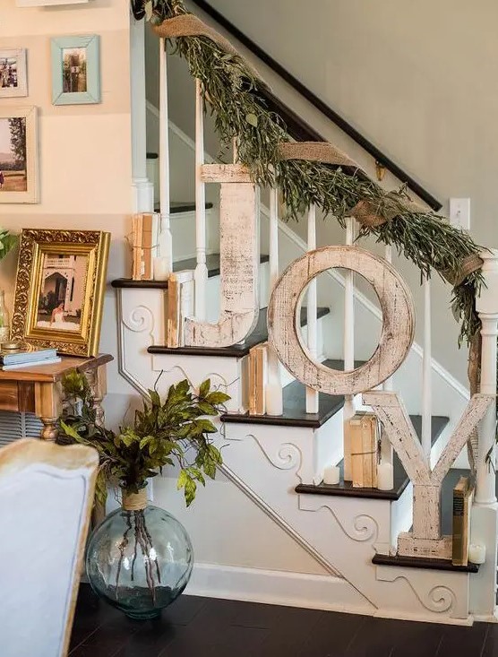 shabby wooden JOY letters attached to the banister and a foliage and burlap garland will match a shabby chic or farmhouse space