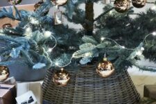 a Christmas tree with shiny copper ornaments