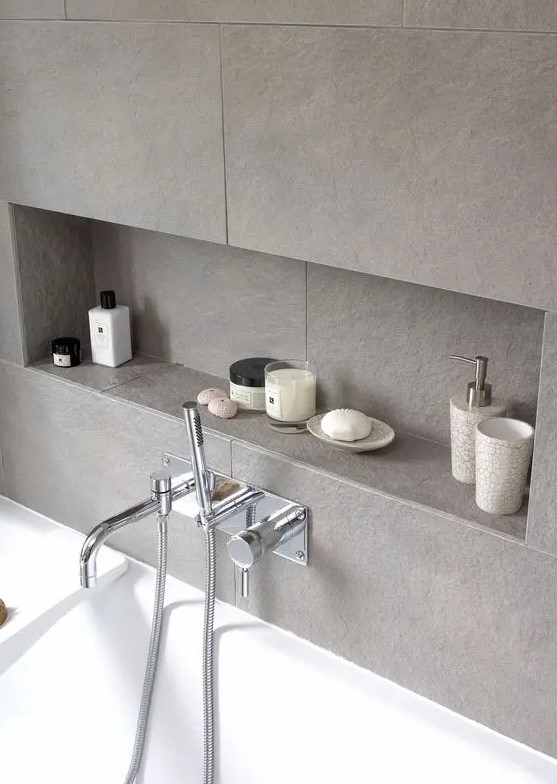a grey tile bathroom wall with a large niche for storage is a great idea as this niche saves a lot of floor and storage space