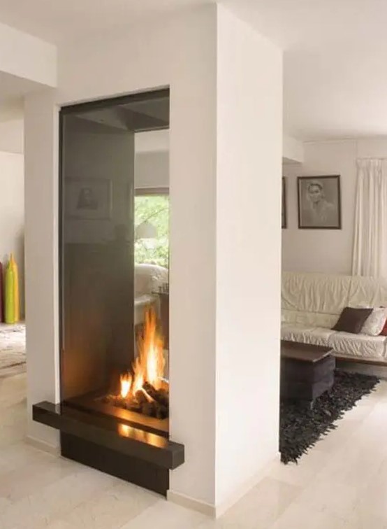 a large clear double sided fireplace will give a lot of interest and will instantly become a centerpiece in any space