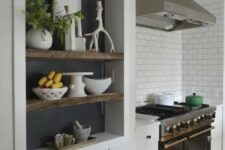 a large niche with shelves, a chalkboard backdrop is a cool idea for a Scandinavian kitchen, it allows you store and display various stuff