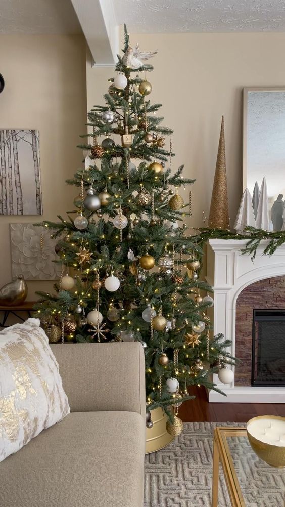 a lovely Christmas tree decorated with clear, white, silver and gold ornaments, lights, stars and snowflakes
