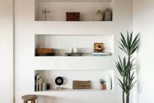 a modern space with a wooden ceiling with beams, a parquet floor and three niche shelves for storing stuff