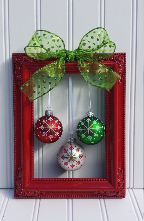 a simple and lovely frame Christmas wreath of a red frame, a red, green and white ornament and a polka dot green bow on top