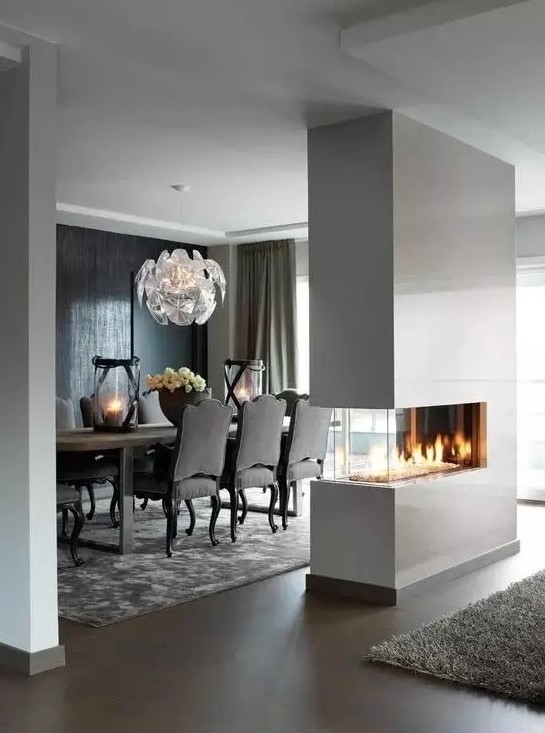 a sleek white minimalist double-sided fireplace will give a chic look to the space and make it cozy