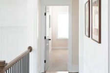 a small transom window adds more light to the corridor and makes the space feel a bit more vintage than modern