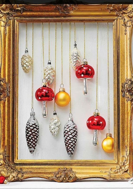 a vintage gold frame Christmas wreath with mushroom, pinecone and usual gold ornaments looks fantastic and very chic
