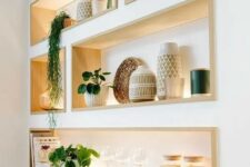 cool niche shelves with stained wooden framing and lights will display your stuff at their best