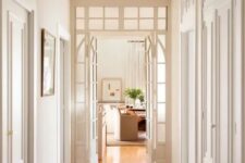 white French doors paired with a transom window are a great way to fill the corridor with natural light and make it cooler