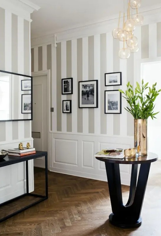 traditional grey and white vertical stripes like these ones are great for making your ceilings look higher, and white paneling adds elegance here