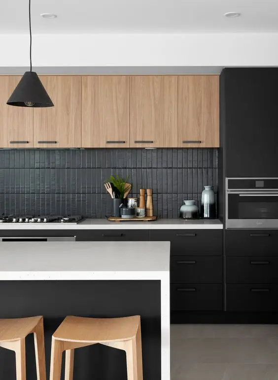 an elegant contemporary black and timber kitchen with sleek cabinets, a matte black kitchen backsplash, a black kitchen island