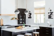 16 a black and white kitchen with black cabinets, white walls, countertops and a backsplash and a matching black and white kitchen island