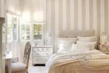17 a neutral serene bedroom with a tan and white accent wall, neutral textiles and refined furniture is very welcoming