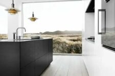 21 a contemporary kitchen with a niche for cooking, a black kitchen island, a glazed wall and cool pendant lamps over the island