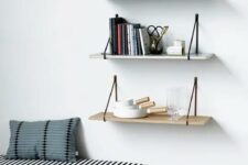 25 a black and white strip upholstered bench with pillows and some hanging shelves over it is a a cool and welcoming space