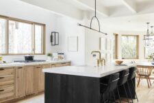 25 a farmhouse kitchen with timber cabinets, a black kitchen island, white countertops, a catchy pendant lamp and a dining zone