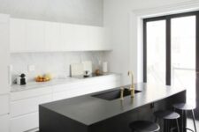 27 a minimalist black and white kitchen with sleek cabinets, a white stone backsplash, a black kitchen island and stools