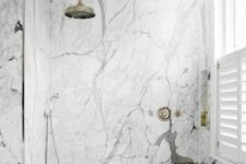 28 a contemporary bathroom with white marble, sleek wood and vintage hardware for a bright and chic look