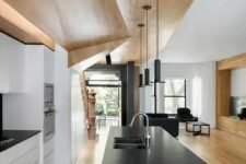 28 a minimalist white kitchen plus a sleek black kitchen island and a geometric ceiling for a wow effect