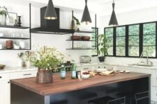 38 a white farmhouse kitchen accented with a black mosaic floor, a black kitchen island and black pendant lamps