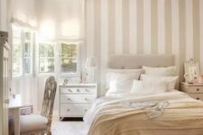 41 a neutral serene bedroom with a tan and white accent wall, neutral textiles and refined furniture is very welcoming
