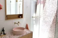 a lovely bathroom with a terrazzo wall