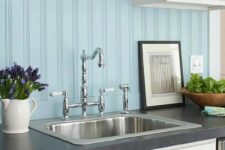 a light blue beadboard backsplash is ideal for a seaside kitchen with neutral cabinetry