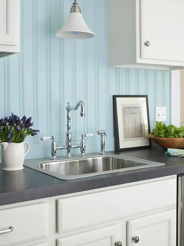 a light blue beadboard backsplash is ideal for a seaside kitchen with neutral cabinetry