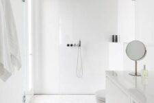 a minimalist white bathroom with a window in the shower space, simple large scale tiles and a floating sleek vanity