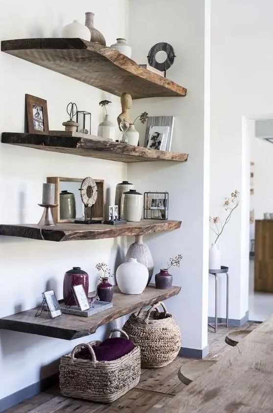rough wood shelves in the awkward corner add a bit of rustic chic to the space, and baskets help with that, too