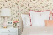 07 a cozy vintage-inspired bedroom with a floral wallpaper wall, polka dot bedding, vintage-inspired furniture and a blush lamp