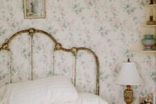 15 a shabby chic bedroom with delicate floral wallpaper, a shabby chic bed, floral bedding, a stool as a nightstand and a vintage lamp