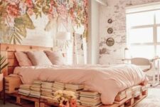24 an eclectic bedroom with a painted floral wall, a pallet bed with blush bedding, stacks of books and bulbs over the space