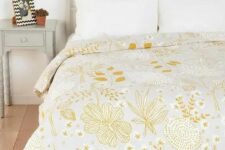 26 a pretty yellow floral and botanical print blanket is all you need to refresh the space for spring