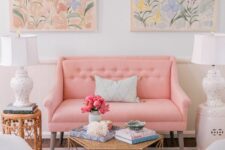 30 a beautiful and sweet pastel living room with a pastel pink sofa and pale blue chairs, pastel floral artworks and a rug plus chic side tables