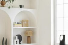 32 niches and arched niches with shelves, with beautiful decor, potted plants and books are great to add interest to the space