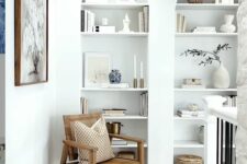 33 two arched wall niches with shelves filled with exquisite and chic decor are amazing for styling a space with an architectural feel