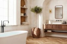 45 a welcoming bathroom with an arched niche and a built-in vanity inside it, an arched niche with storage shelves and an oval tub