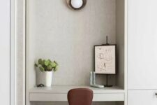 52 an arched niche with a wall sconce, an artwork and a potted plant can act as a tiny working space