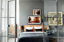 French doors with a modern look in black frames to separate the bedroom from the rest of the apartment