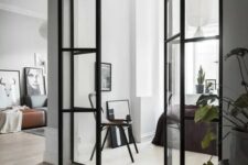 Scandinavian interiors with black framed French doors to fill the spaces with light
