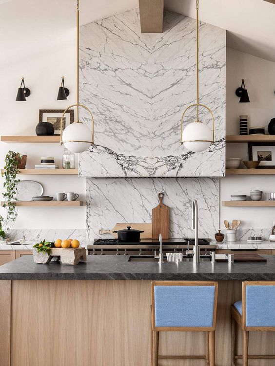 a beautiful conemporary kitchen with stained cabinets and a kitchen island, a white quartz countertop and a backsplash, a kitchen island with a black quartz countertop