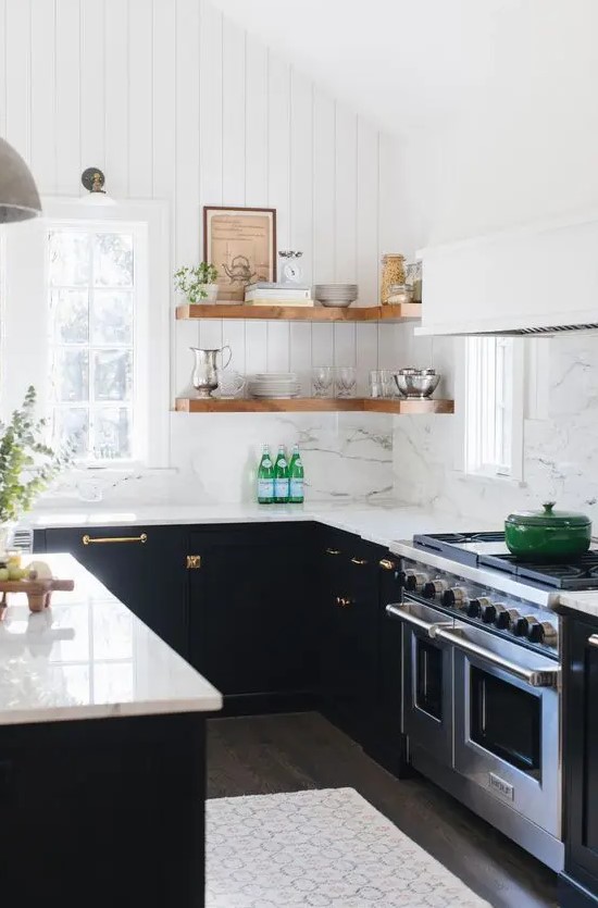 a black U-shaped kitchen with a white quartz backsplash and countertops, stained corner shelves and greenery