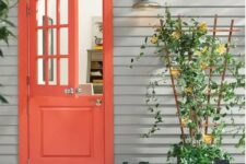a lovely entrance with a bold red door