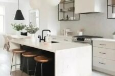 a chic contemporary kitchen with elegant white cabinets, a white tile backsplash, a black kitchen island with a white stone countertop and pendant lamps