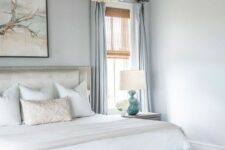a cozy bedroom with wood bead chandelier