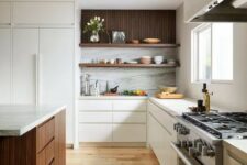 a contemporary kitchen sleek flat panel white cabinets, open shelves, a dark-stained kitchen island and white stone countertops