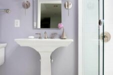 a lilac bathroom with a free-standing sink, a glass-enclosed shower space and white appliances with a vintage feel