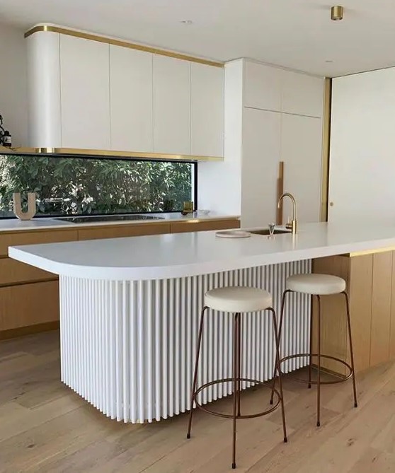 a minimalist kitchen with sleek curved cabinets, stained ones, a window backsplash, a curved fluted kitchen island and tall stools