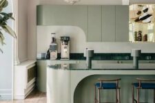 a lovely pastel green kitchen design